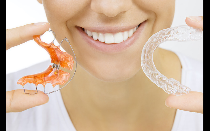 A clear plastic retainer and a metal wire retainer 